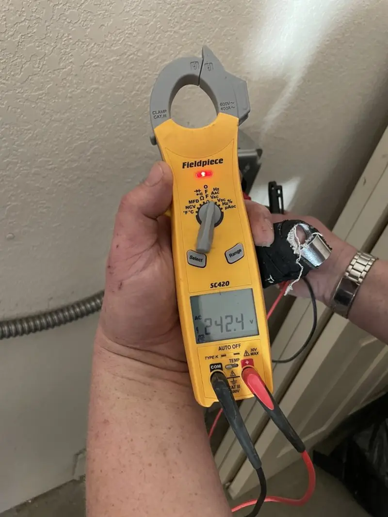 Voltage testing with clamp meter during Generator Installation in Woodbridge